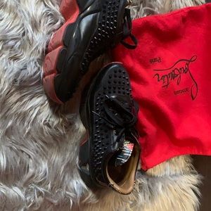 Louboutin spiked black sneakers